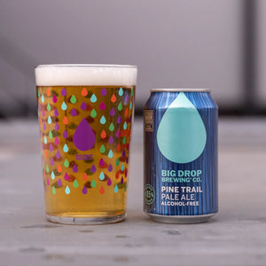 Alcohol-free Big Drop pale ale beer and branded pint glass