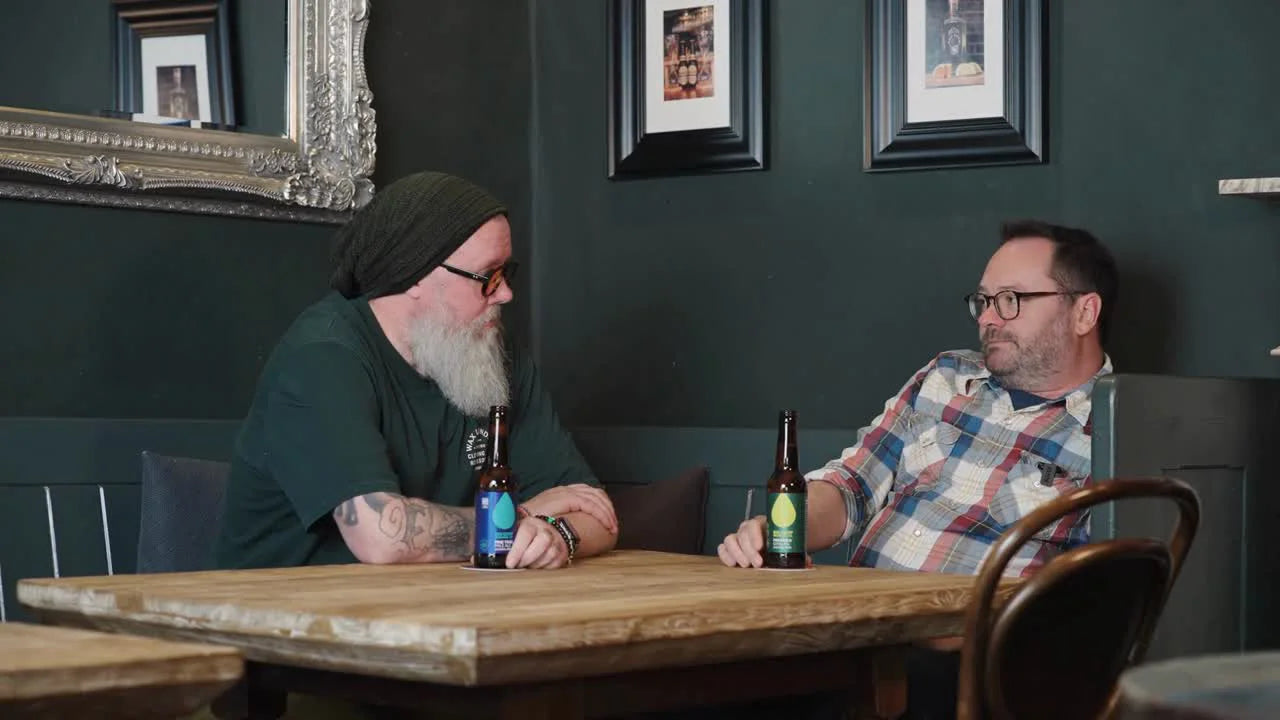 Big Drop founders chatting over a beer
